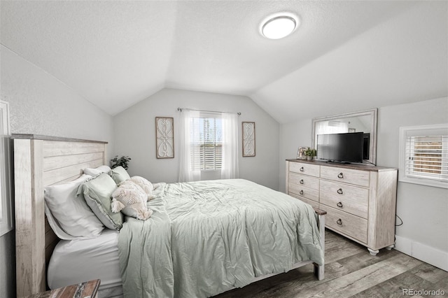 800 S Krameria St, Denver, CO 80224 - bedroom with light wood-style floors, vaulted ceiling, multiple windows, a textured ceiling, and baseboards