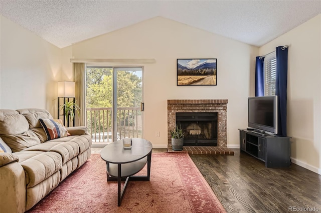 living room featuring a fireplace, lofted ceiling, dark hardwood / wood-style floors, and a textured ceiling