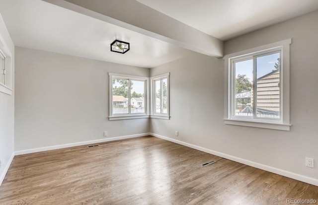 empty room featuring hardwood / wood-style floors