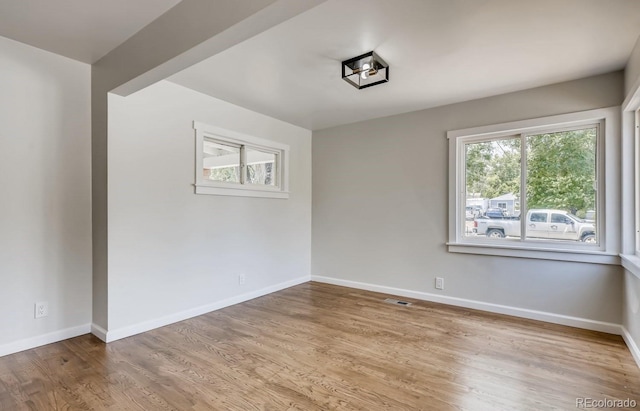 spare room with light hardwood / wood-style floors