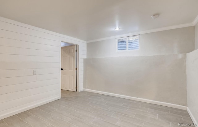 unfurnished room featuring crown molding