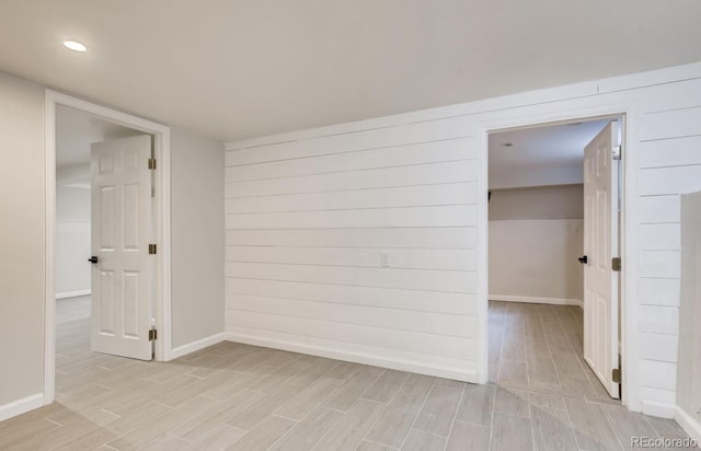 empty room with light hardwood / wood-style floors