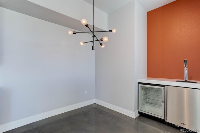 interior space with bar and a notable chandelier