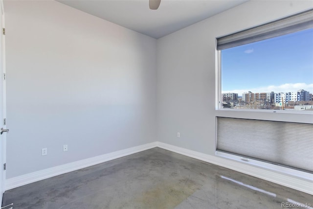 spare room with ceiling fan