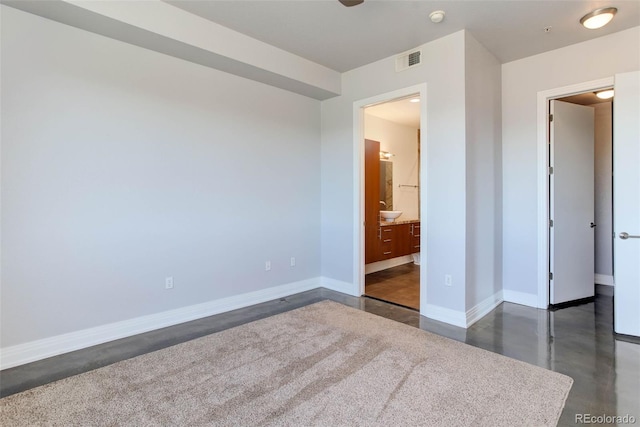 unfurnished bedroom featuring ensuite bathroom