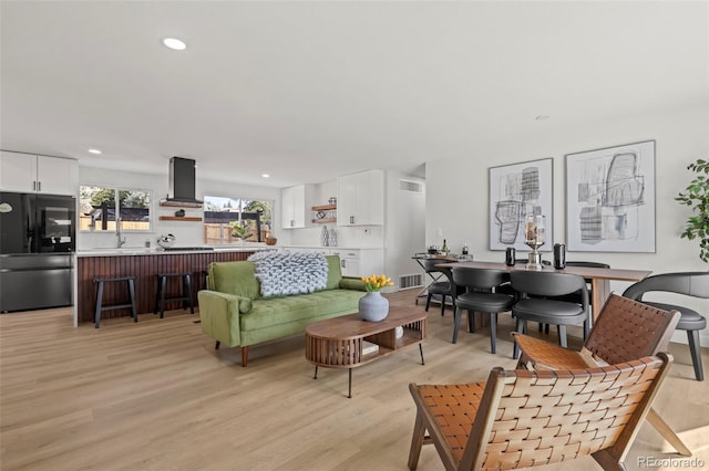 living room with light hardwood / wood-style floors