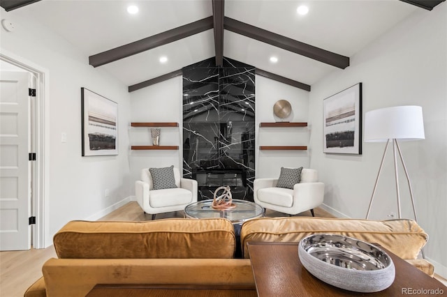 living room featuring hardwood / wood-style flooring and lofted ceiling with beams