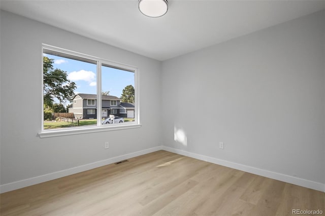 unfurnished room featuring light hardwood / wood-style flooring