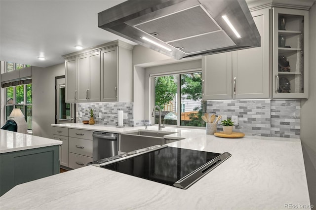 6285 Moccasin Pass Ct, Colorado Springs, CO 80919 - kitchen with wall chimney exhaust hood, stainless steel dishwasher, decorative backsplash, healthy amount of natural light, and recessed lighting