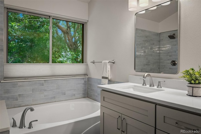 6285 Moccasin Pass Ct, Colorado Springs, CO 80919 - full bathroom featuring vanity, a bath, and a tile shower