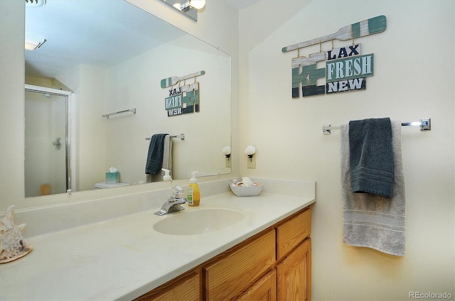 bathroom with vanity, toilet, and an enclosed shower