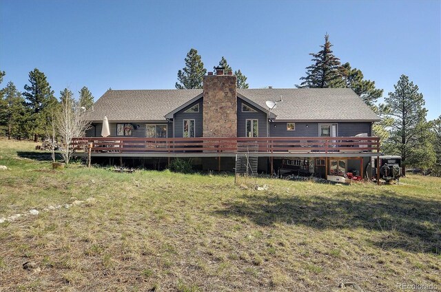 18360 Trail W Dr, Buena Vista, CO 81211 - rear view of property featuring a wooden deck, a chimney, and a shingled roof
