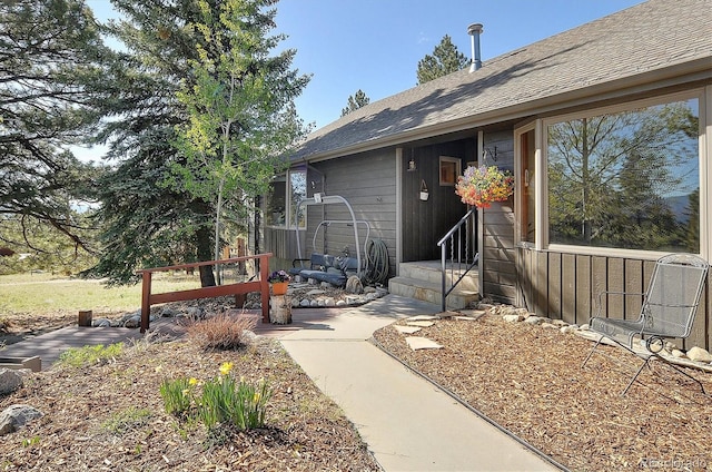18360 Trail W Dr, Buena Vista, CO 81211 - property entrance with a shingled roof and a patio