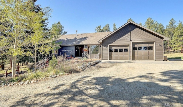 18360 Trail W Dr, Buena Vista, CO 81211 - view of front facade with driveway and an attached garage