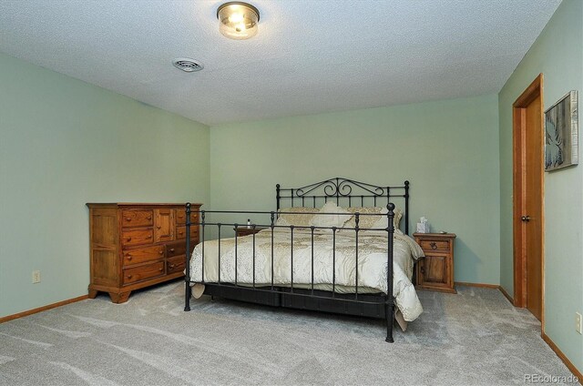 18360 Trail W Dr, Buena Vista, CO 81211 - carpeted bedroom with a textured ceiling and baseboards