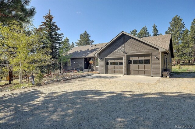 18360 Trail W Dr, Buena Vista, CO 81211 - view of front of house with a garage and driveway