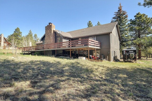 18360 Trail W Dr, Buena Vista, CO 81211 - rear view of house with a deck and a chimney