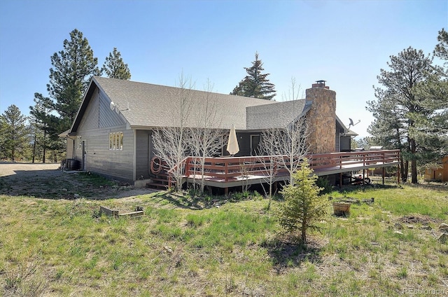18360 Trail W Dr, Buena Vista, CO 81211 - rear view of house with a wooden deck, a chimney, and a shingled roof