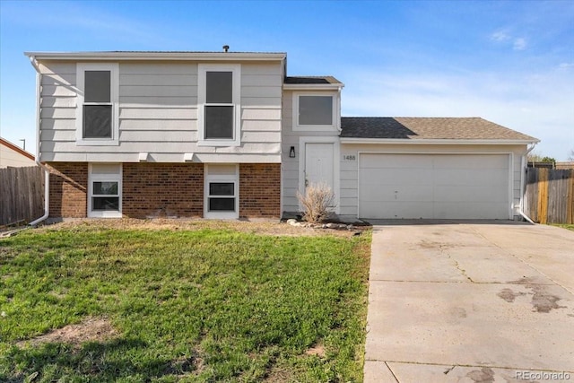 1488 S Andes Way, Aurora, CO 80017 - split level home featuring brick siding, an attached garage, and concrete driveway