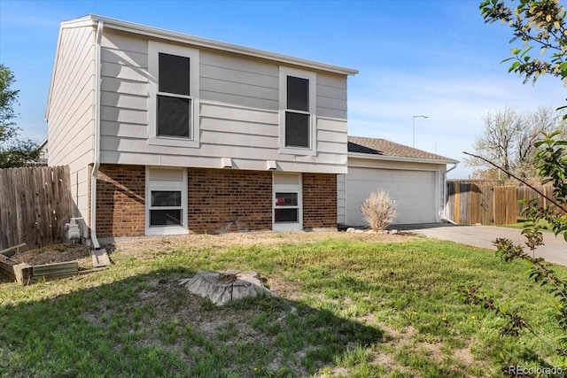 1488 S Andes Way, Aurora, CO 80017 - view of front of house featuring brick siding, a garage, and concrete driveway