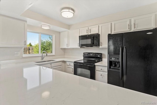1488 S Andes Way, Aurora, CO 80017 - kitchen featuring black appliances, a sink, and white cabinetry