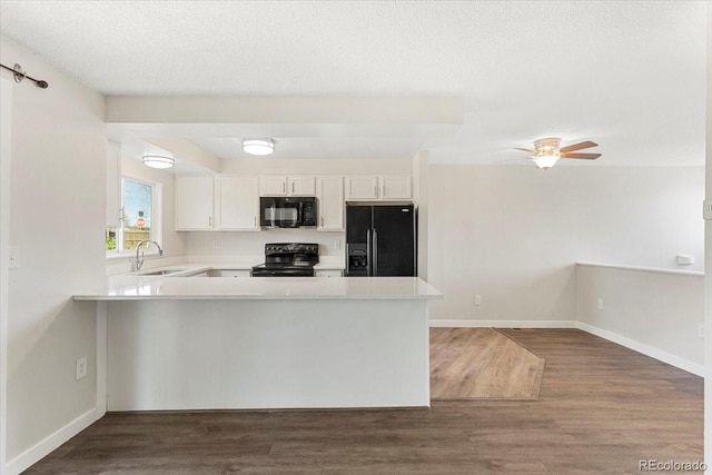 1488 S Andes Way, Aurora, CO 80017 - kitchen with black appliances, a sink, a peninsula, and light countertops