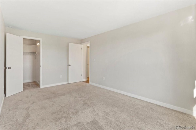 1488 S Andes Way, Aurora, CO 80017 - unfurnished bedroom with carpet floors, baseboards, a spacious closet, and a closet
