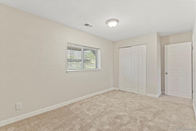 1488 S Andes Way, Aurora, CO 80017 - unfurnished bedroom with baseboards, carpet, and a closet