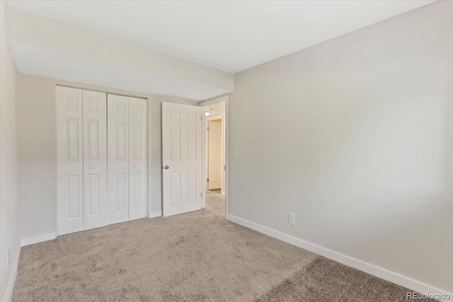 1488 S Andes Way, Aurora, CO 80017 - unfurnished bedroom with carpet flooring, baseboards, and a closet