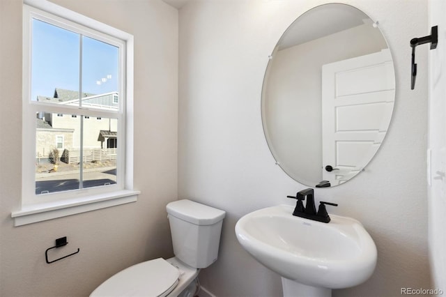 bathroom with sink and toilet