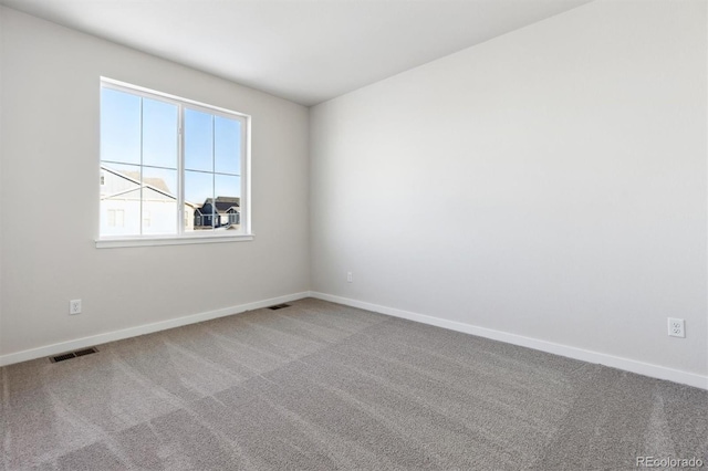 unfurnished room with carpet floors