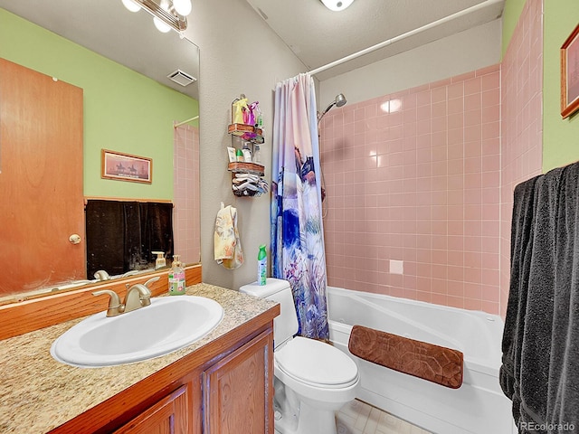 full bathroom featuring vanity, toilet, and shower / tub combo