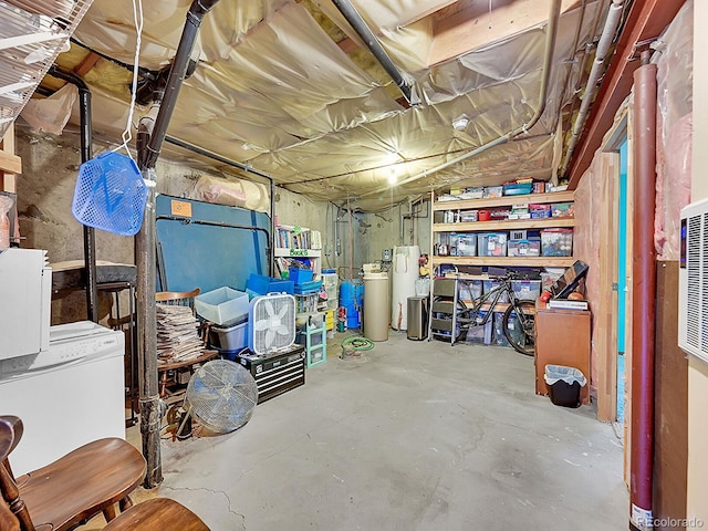 basement with gas water heater and fridge