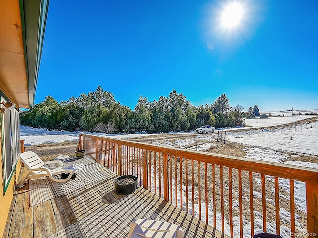 view of snow covered deck