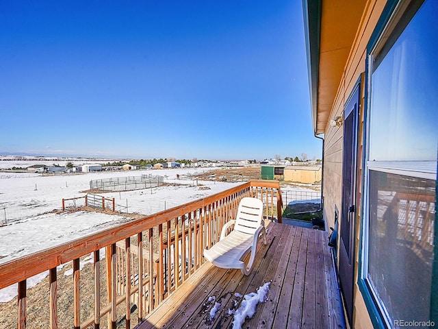 view of snow covered deck