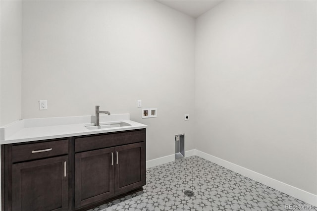 clothes washing area featuring cabinets, hookup for an electric dryer, hookup for a washing machine, and sink