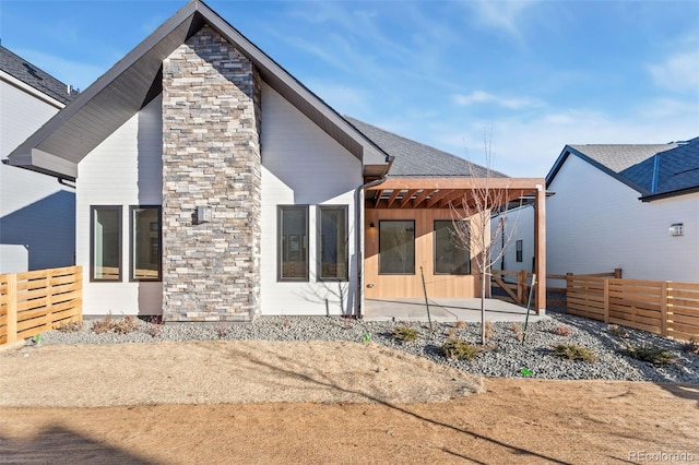 rear view of house with a patio