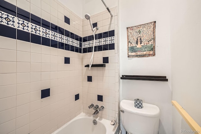 bathroom featuring shower / bathtub combination and toilet