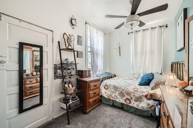 bedroom featuring carpet flooring and a ceiling fan