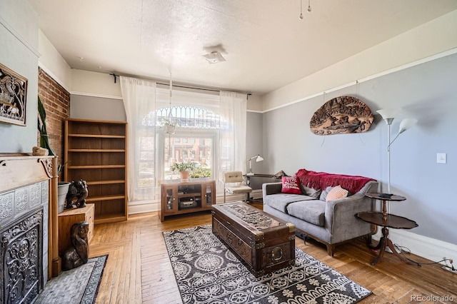 living room with baseboards and hardwood / wood-style flooring