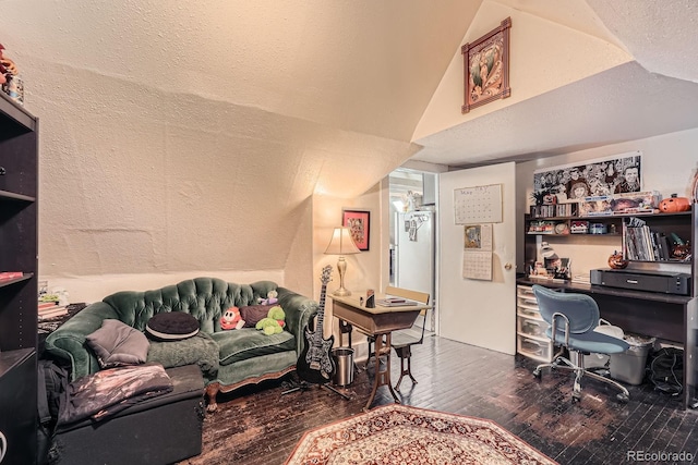 office space with wood-type flooring and vaulted ceiling