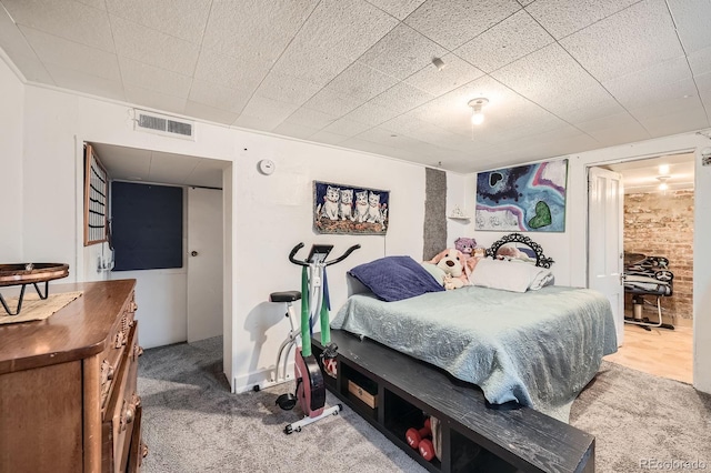 carpeted bedroom with visible vents