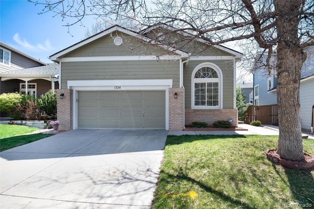 view of front of property with brick siding, driveway, fence, and a front lawn