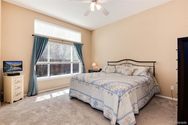 bedroom featuring carpet floors, a ceiling fan, and baseboards