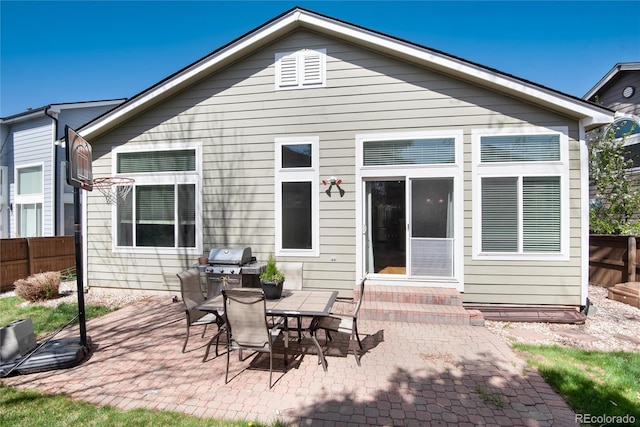 back of house featuring fence, a patio area, and entry steps