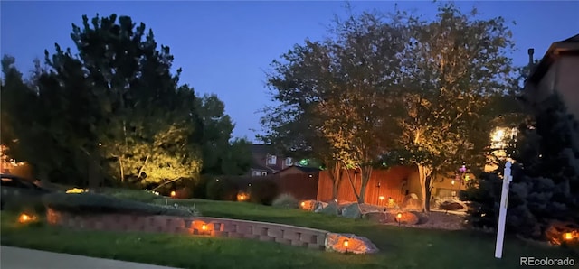 view of yard at twilight