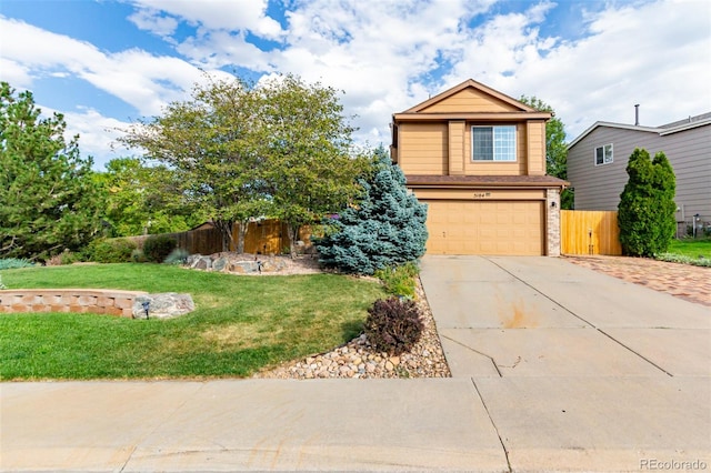 view of front of home with a garage and a front yard