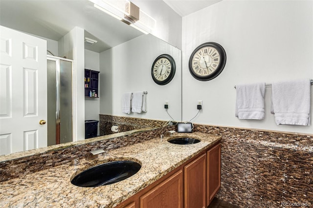 bathroom with vanity and an enclosed shower