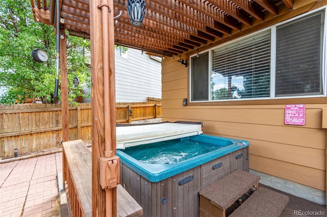 view of patio with a hot tub