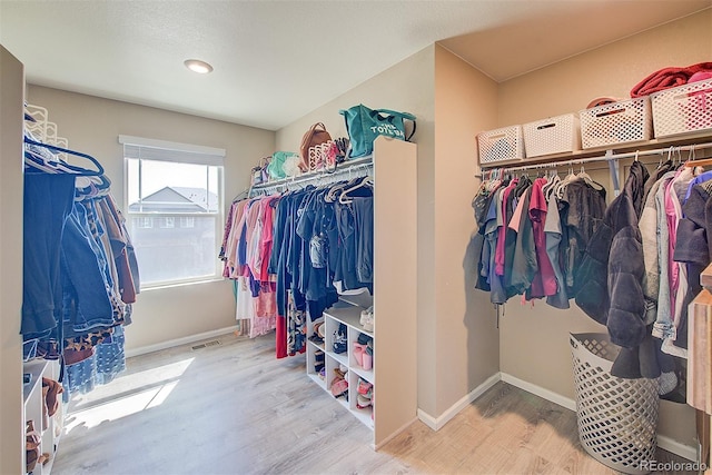 walk in closet featuring wood-type flooring